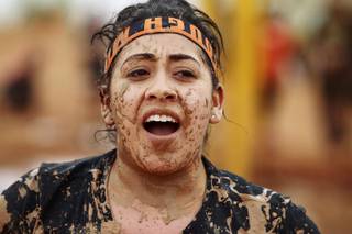 A mud splattered participant is seen during the Tough Mudder event at Lake Las Vegas Saturday, April 26, 2014.