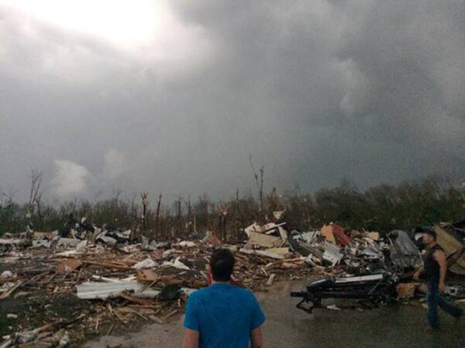 This photo provided by James Bryant shows tornado damage, Sunday, April 27, 2014, in Mayflower, Ark. A powerful storm system rumbled through the central and southern United States on Sunday, spawning several tornadoes, including one in a small northeastern Oklahoma city and another that carved a path of destruction through several northern suburbs of Little Rock, Ark.