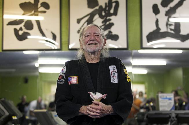 Willie Nelson, the country music icon who turns 81 this week, smiles as he receives his fifth-degree black belt in the martial art of Gong Kwon Yu Sul on Monday, April 28, 2014, in Austin, Texas. 