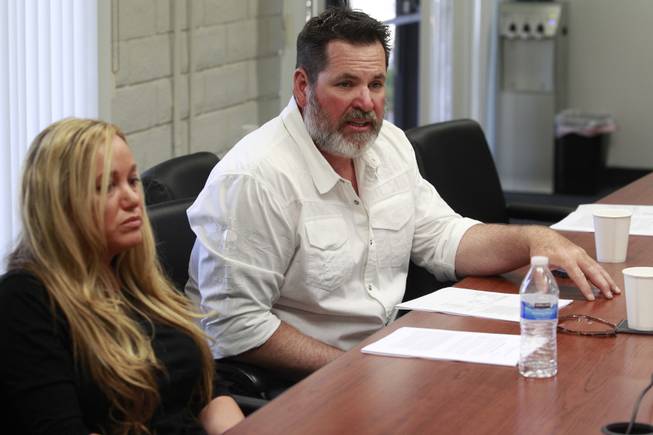 Aimee Hairr listens while Kyle Bryan talks about the lawsuit filed by the ACLU on their behalf against Clark County school officials Tuesday, April 29, 2014 