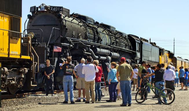 Visitors view the Big Boy No. 4014 steam locomotive on a stop at Union Pacific Railroad in Las Vegas on its way to Cheyenne, Wyoming, on Wednesday, April 30, 2014.  It will to be restored at the Union Pacific Heritage Steam Fleet Operations  there over the next five years.