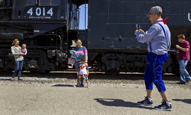 Visitors enjoy seeing the Big Boy No. 4014 steam locomotive on a stop at Union Pacific Railroad in Las Vegas on its way to Cheyenne, Wyoming, on Wednesday, April 30, 2014.  It will to be restored at the Union Pacific Heritage Steam Fleet Operations  there over the next five years.