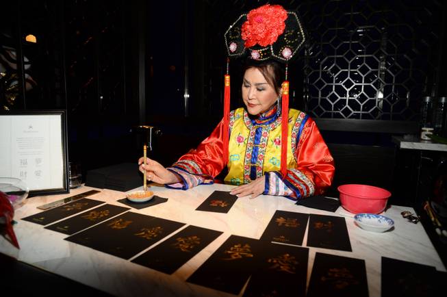 A calligrapher at Night 1 of Hakkasan’s first-anniversary celebrations Thursday, ...