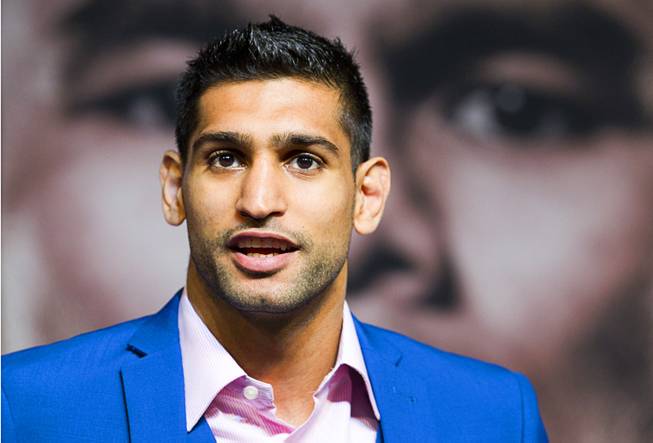Welterweight boxer Amir Khan of Britain speaks during a news conference for undercard boxers at the MGM Grand Thursday, May 1, 2014. Khan will fight Luis Collazo  at the MGM Grand Garden Arena on Saturday.