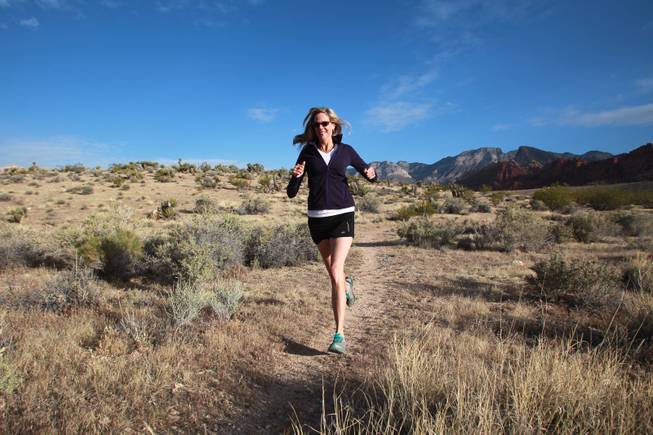 Ultramarathon runner Molly Sheridan runs cross country on a trail at Red Rock National Conservation Area Wednesday, April 23, 2014.