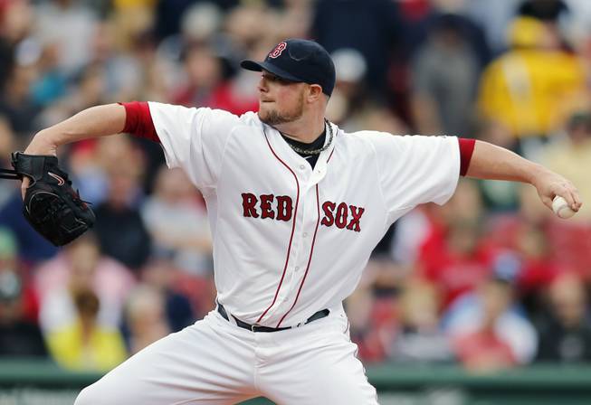 Boston Red Sox's Jon Lester pitches in the first inning of a baseball game against the Oakland Athletics in Boston on Saturday, May 3, 2014. 