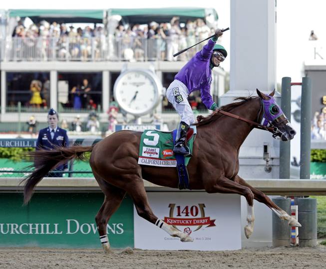 Victor Espinoza rides California Chrome to a victory during the 140th running of the Kentucky Derby horse race at Churchill Downs on Saturday, May 3, 2014, in Louisville, Ky. 