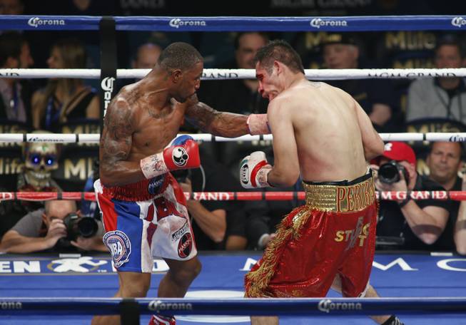 J'Leon Love, left, of the U.S. connects on Marco Antonio Periban of Mexico during their super middleweight fight at the MGM Grand Garden Arena on Saturday, May 3, 2014.