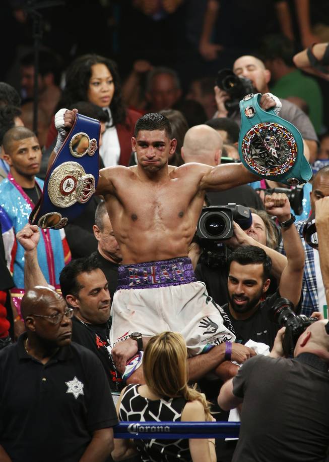 Amir Khan of Britain celebrates his victory over Luis Collazo of the U.S. during their welterweight fight at the MGM Grand Garden Arena on Saturday, May 3, 2014.
