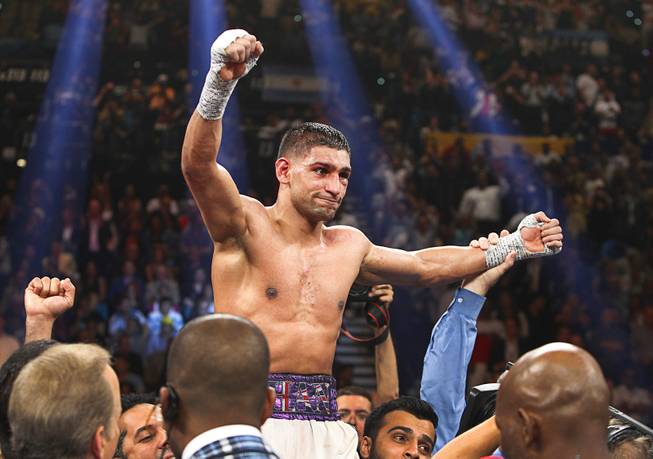 Amir Khan of Britain celebrates his victory over Luis Collazo after their welterweight fight at the MGM Grand Garden Arena Saturday, May 3, 2014.