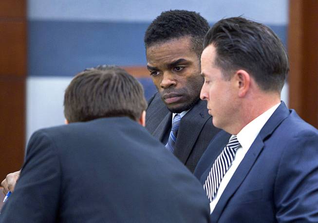 Jason "Blu" Griffith, center, the man accused of killing Luxor "Fantasy" dancer Debora Flores Narvaez, listens to defense attorneys Abel Yanez, left, and Jeff Banks before the start of jury selection, at the Regional Justice Center Monday, May 5, 2014.