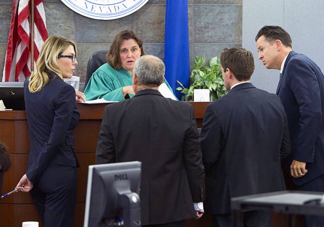 District Court Judge Kathleen Delaney confers with attorneys as jury selection begins in the trial for Jason "Blu" Griffith, the man accused of killing Luxor "Fantasy" dancer Debora Flores Narvaez, at the Regional Justice Center Monday, May 5, 2014.