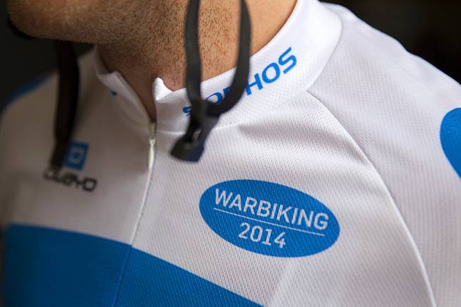 James Lyne, global head of security research at Sophos, wears a custom jersey as he prepares to go "war biking" in Las Vegas Monday, May 5, 2014. His bicycle is equipped with a scanner and computer that can detect Wi-Fi networks. Sophos is a British-based Internet security company.