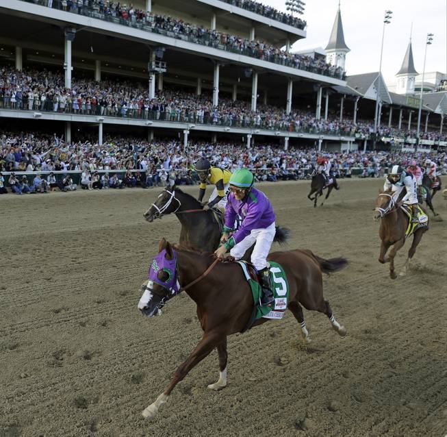 Victor Espinoza rides California Chrome to a victory during the 140th running of the Kentucky Derby horse race at Churchill Downs Saturday, May 3, 2014, in Louisville, Ky. 