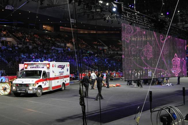 First responders work at the center ring after a platform collapsed during an aerial hair-hanging stunt at the Ringling Brothers and Barnum and Bailey Circus, Sunday, May 4, 2014, in Providence, R.I. At least nine performers were seriously injured in the fall, including a dancer below, while an unknown number of others suffered minor injuries. (AP Photo/Providence Journal, Bob Breidenbach) MANDATORY CREDIT; ONLINE OUT; RHODE ISLAND MEDIA OUT; NO SALES