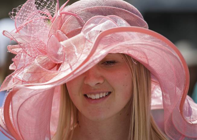 Megan Iteen smiles before the 140th running of the Kentucky Derby horse race at Churchill Downs Saturday, May 3, 2014, in Louisville, Ky.