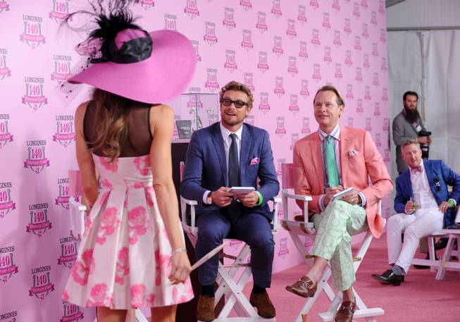 IMCelebrity judges Simon Baker, center, and Carson Kressley, right, judge the Longines Kentucky Oaks Fashion Contest on Kentucky Oaks Day, Friday, May 2, 2014, in Louisville, Ky.  Longines, the Swiss watch manufacturer known for its luxury timepieces, is the Official Watch and Timekeeper of the 140th annual Kentucky Derby.