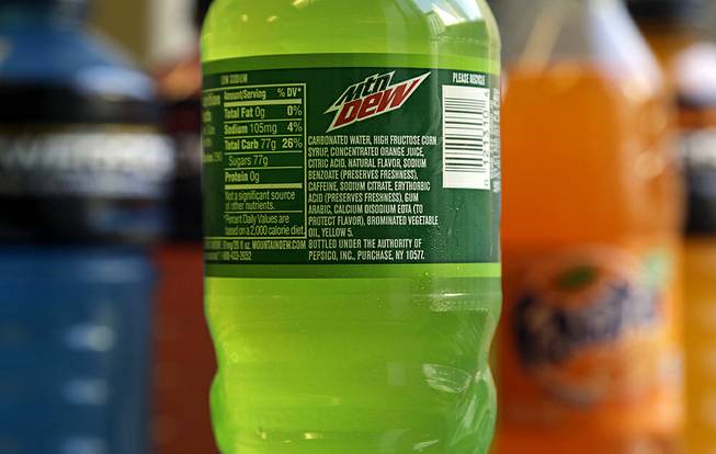 The ingredients on a bottle of Mountain Dew are photographed in San Francisco on Monday, May 5, 2014. Coca-Cola said Monday that it will drop brominated vegetable oil from all of its drinks that contain it and not just Powerade. 