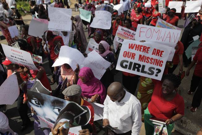 Women attend a mass-demonstration calling on the government to increase efforts to rescue the hundreds of missing kidnapped school girls of a government secondary school Chibok, in Lagos, Nigeria, Monday, May 5, 2014