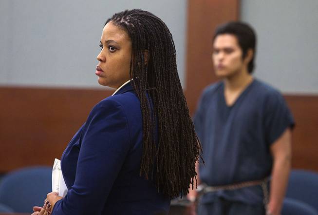 Defense attorney Donishia Campbell, left, represents Jeremy Espiritu, 22, during sentencing at the Regional Justice Center Tuesday, May 6, 2014. Espiritu told police that he stabbed the family dog, Serenity, with a six-inch serrated knife because he "wanted to." The dog later died of the injury. 