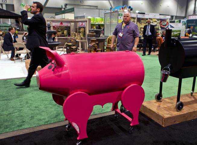 The Traeger BBQPig Lil' Pig is hard to miss amongst the many others at the National Hardware Show 2014 in the Las Vegas Convention Center on Wednesday, May 7, 2014.   L.E. Baskow