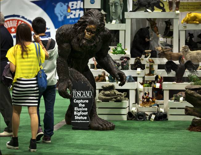 Visitors are stopped by the sight of Bigfoot, the Garden Yeti, on display by Design Toscano during the National Hardware Show 2014 in the Las Vegas Convention Center on Wednesday, May 7, 2014.   L.E. Baskow