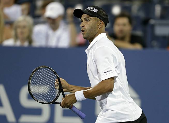 American tennis star James Blake reacts during a first round match against Ivo Karlovic, of Croatia, at the U.S. Open tennis tournament in New York, Aug. 28, 2013. 