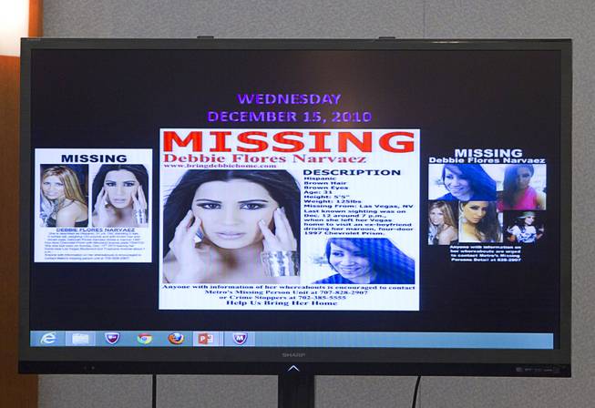 Missing person fliers are displayed on a video monitor as prosecutor Marc DiGiacomo gives opening statements during the trial for Jason Omar Griffith at the Regional Justice Center Thursday, May 8, 2014. Griffith is accused of murdering Luxor "Fantasy" dancer Deborah Flores Narvaez in December 2010.