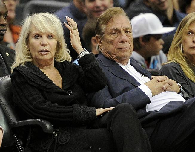 Los Angeles Clippers owner Donald Sterling sits with his wife, Shelly, during a Clippers game against the Detroit Pistons in Los Angeles. 