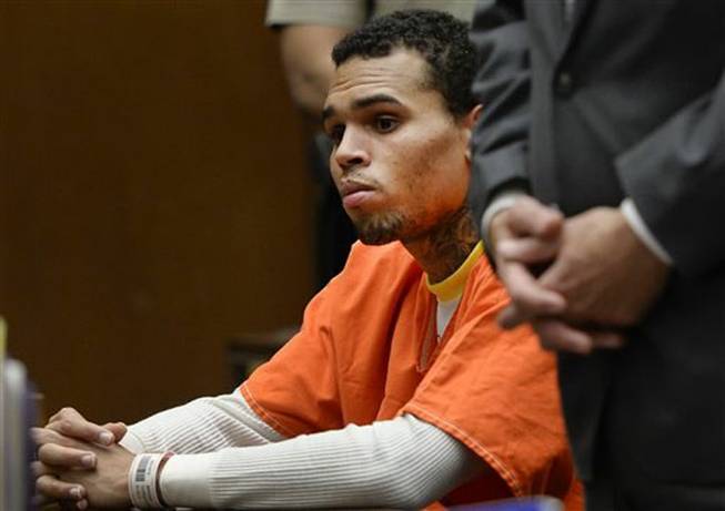 R&B singer Chris Brown appeared Friday in Los Angeles Superior Court and admitted he violated his probation, and was sentenced to serve an additional 131 days in jail. He is shown here in court on Thursday, May 1, 2014. The probation issues were related to the singer’s 2009 assault case filed after his attack on then-girlfriend Rihanna.