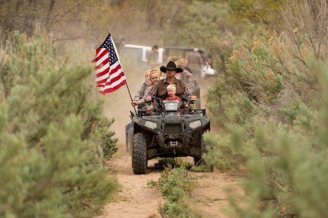 Ryan Bundy, son of Nevada rancher Cliven Bundy, rides an ATV into Recapture Canyon north of Blanding, Utah, on Saturday, May 10, 2014, in a protest against what demonstrators call the federal government's overreaching control of public lands. The area has been closed to motorized use since 2007 when an illegal trail was found that cuts through Ancestral Puebloan ruins. The canyon is open to hikers and horseback riders.