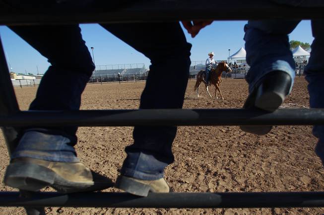 A cowgirl waits to corral a steer during the Bighorn Rodeo Saturday, May 10, 2014. The Bighorn Rodeo is an annual event put on by the Nevada Gay Rodeo Association.