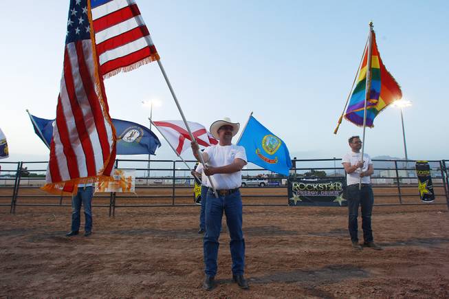 Men hold flags during the Grand Entry at the Bighorn Rodeo Saturday, May 10, 2014. The Bighorn Rodeo is an annual event put on by the Nevada Gay Rodeo Association.