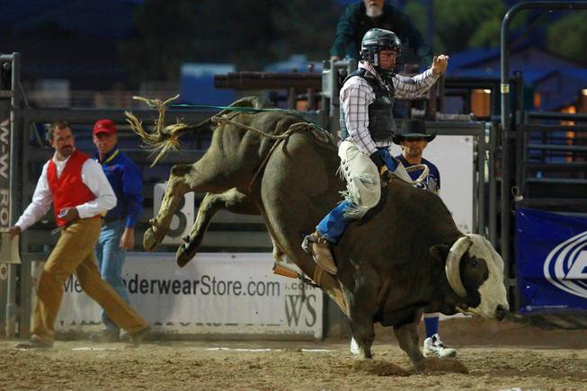 Jason Strand competes in bull riding during the Bighorn Rodeo Saturday, May 10, 2014. The Bighorn Rodeo is an annual event put on by the Nevada Gay Rodeo Association.