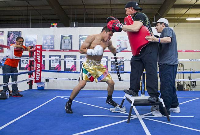 Las Vegan Jessie Vargas works on his timing with trainer Ismael Salas at Top Rank Gym Monday, May 12, 2014. Vargas defeated Khabib Allakhverdiev of Russia at the MGM Grand Garden Arena on April 12 to take the WBA super lightweight (140 lbs.) title. Allakhverdiev was previously undefeated.