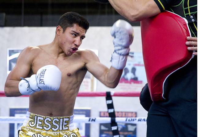 Las Vegas boxer Jessie Vargas works out with trainer Ismael Salas at Top Rank Gym on Monday, May 12, 2014.