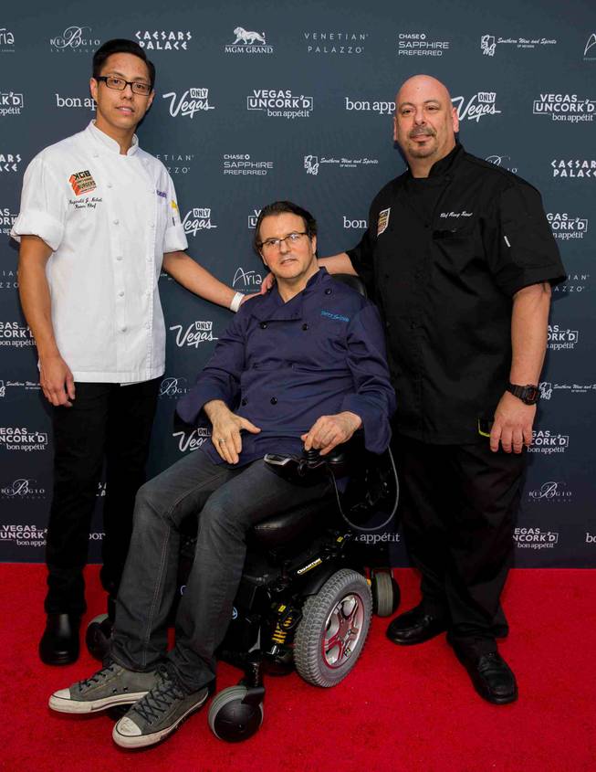 Kerry Simon, center, arrives at the Grand Tasting of 2014 Vegas Uncork’d by Bon Appetit on Friday, May 9, 2014, at Garden of the Gods in Caesars Palace.
