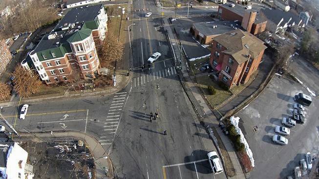 This Feb. 1, 2014 photo, taken by a camera mounted on a drone aircraft and provided by Pedro Rivera, shows an auto that crashed into a building in Hartford, Conn. Rivera filed a federal lawsuit Tuesday, Feb. 18, 2014, alleging that Hartford police officers violated his  rights by demanding he stop using the aircraft to record images of the wreck. 