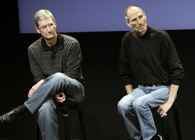 This July 16, 2010 photo shows Apple's Tim Cook, left, and Steve Jobs, right, during a meeting at Apple in Cupertino, Calif. 