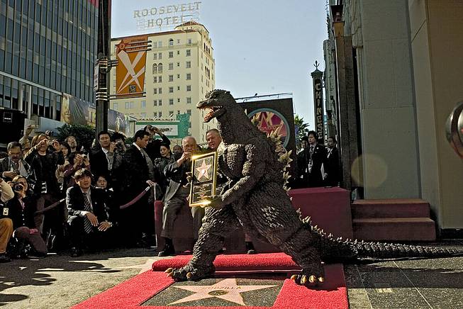 In this Nov. 29, 2004, file photo, the Godzilla character celebrates its 50th anniversary with a star on the Hollywood Walk of Fame next to Grauman's Chinese Theater, now TCL Chinese Theater, along Hollywood Boulevard in Los Angeles. 