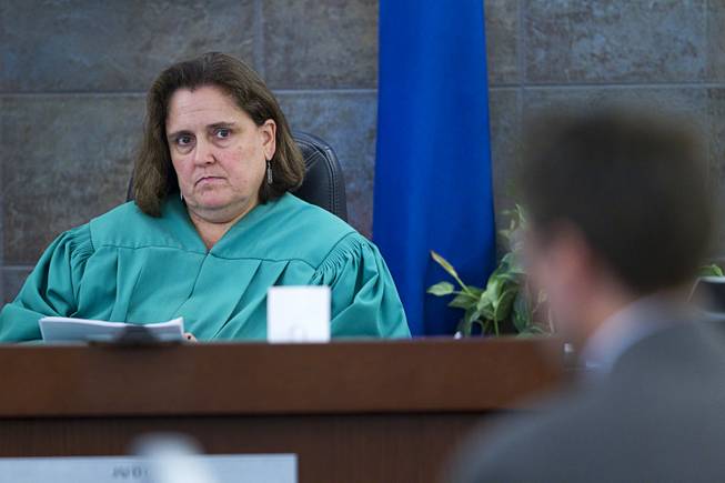 Judge Kathleen Delaney listens to defense attorney Abel Yanez as he cross examines Louis Colombo, 35, a former housemate of Jason Omar Griffith, during Griffith's trial at the Regional Justice Center Tuesday, May 13, 2014. Colombo testified he helped Griffith dispose of the body of Luxor "Fantasy" dancer Deborah Flores Narvaez in 2010.