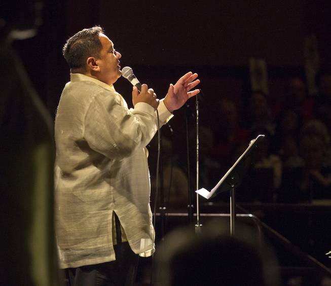 Edward Granadosin sings "I Dreamed A Dream" near the conclusion of the Nevadans for the Common Good gathering at the Cashman Center for their second community convention on Tuesday, May 13, 2014. He is with Advent UMC.