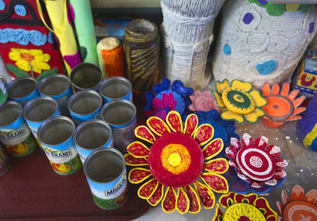 Artwork by seniors is displayed at the Nevada Senior Services Adult Day Care Center of Las Vegas, 901 N. Jones Blvd., Wednesday, May 14, 2014.  The artwork at the center is mostly made with repurposed materials like the fruit cans at left.