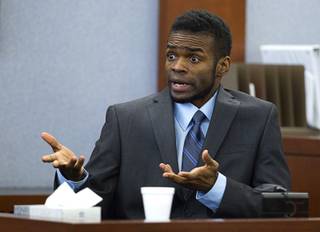 Defendant Jason Omar Griffith speaks to the jury as he testifies in his own defense during his trial at the Regional Justice Center Wednesday, May 14, 2014. Griffith is accused of murdering Luxor 