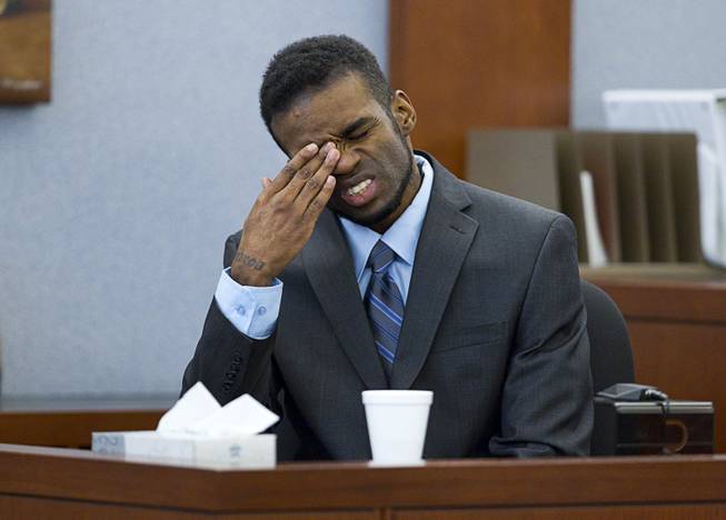 Defendant Jason Omar Griffith reacts as a 9-1-1 recording is played during his trial at the Regional Justice Center Wednesday, May 14, 2014. Griffith is accused of murdering Luxor "Fantasy" dancer Deborah Flores Narvaez in December 2010.