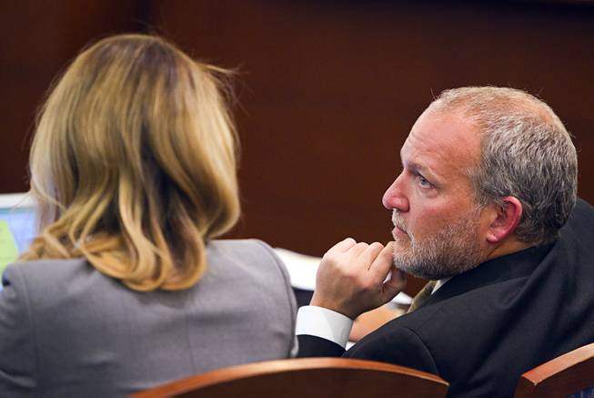 Prosecutors Marc DiGiacomo, right, and Michelle Fleck confer during a trial for Jason Omar Griffith at the Regional Justice Center Wednesday, May 14, 2014. Griffith is accused of murdering Luxor "Fantasy" dancer Deborah Flores Narvaez in December 2010.