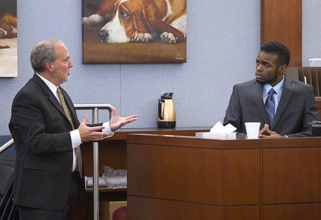 Prosecutor Marc DiGiacomo, left, asks a question to defendant Jason Omar Griffith as Griffith testifies in his own defense during his trial at the Regional Justice Center Wednesday, May 14, 2014. Griffith is accused of murdering Luxor "Fantasy" dancer Deborah Flores Narvaez in December 2010.