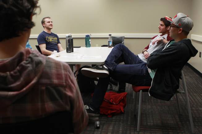 From left Trevor Scheer, Omid Mahban and Michael Fildes talk during a meeting of the UNLV's NRAP recovery support group Wednesday, April 30, 2014.