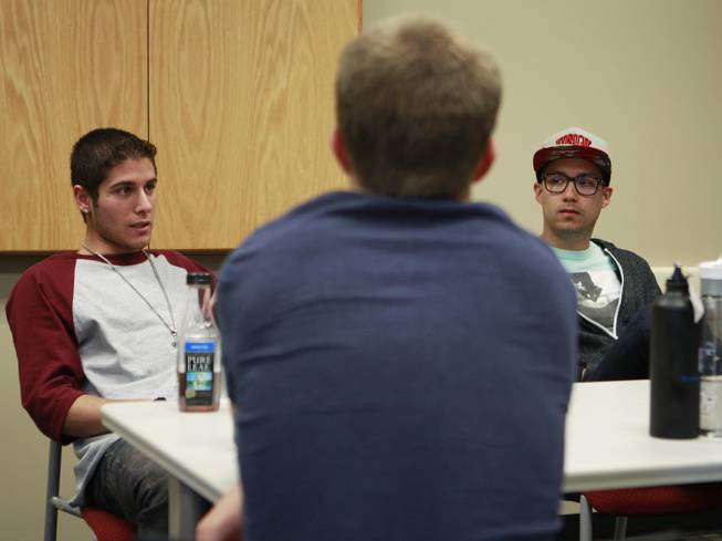 From left, Omid Mahban, Trevor Scheer and Michael Fildes talk during a meeting of the UNLV's NRAP recovery support group Wednesday, April 30, 2014.