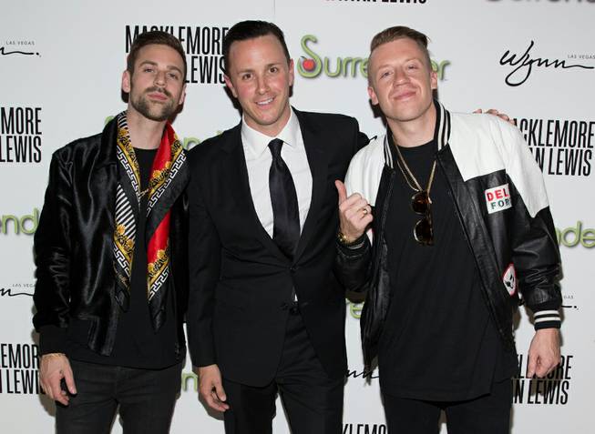 Sean Christie is flanked by Macklemore, right, and Ryan Lewis during Surrender's third-anniversary celebration Thursday, June 6, 2013, at Encore.